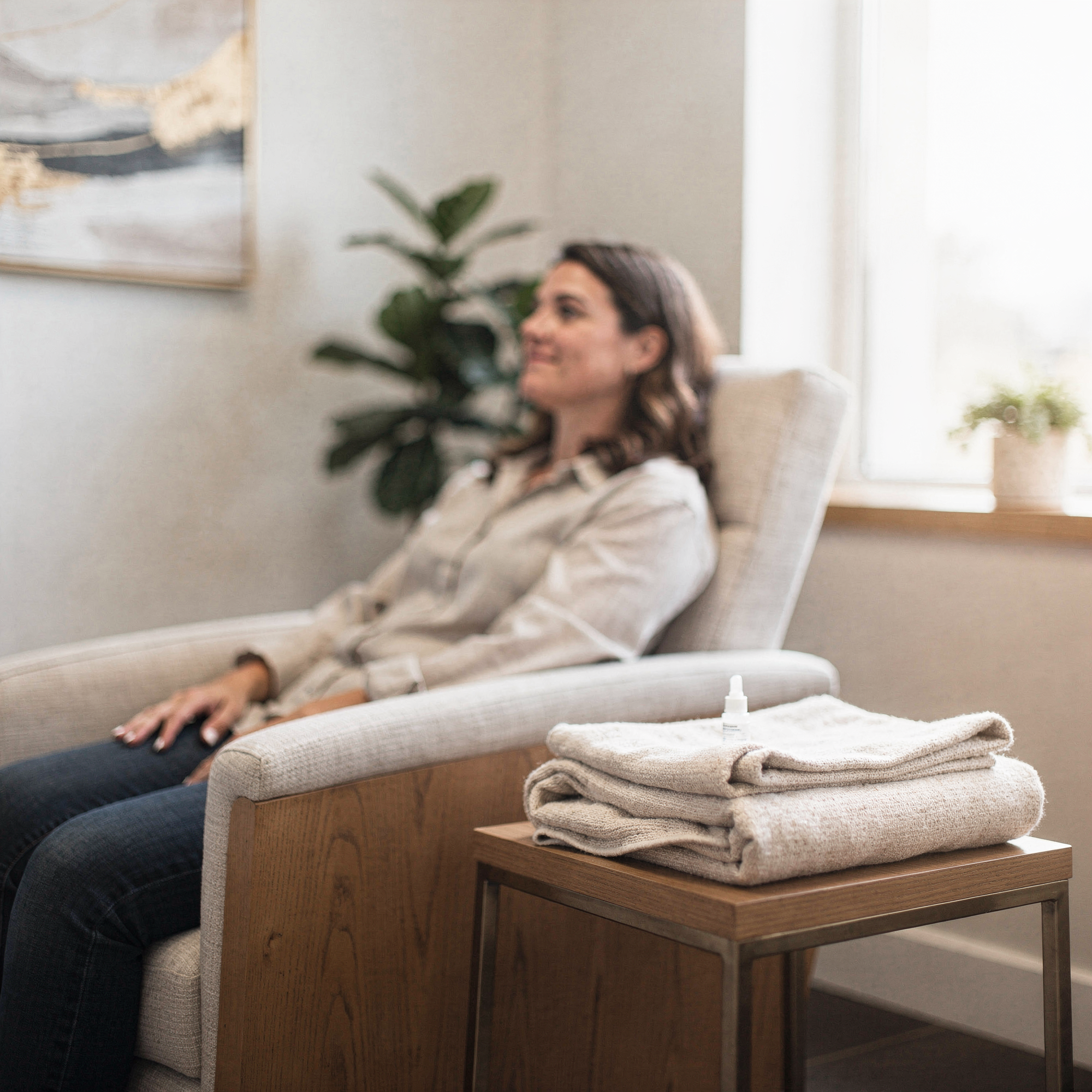 Patient relaxing in a comfortable chair during Spravato treatment at Neowellnez
